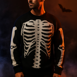 Black knit pullover sweater with white skeleton ribcage and bone pattern, cozy Halloween-themed clothing.