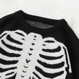 Black knit pullover sweater with white skeleton ribcage and bone pattern, cozy Halloween-themed clothing.