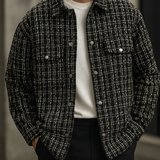 Men’s dark tweed plaid shacket jacket styled casually over white tee.