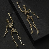 Dangly skeleton earrings with gold finish – Parker & Stone