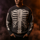 Grey knit pullover sweater with white skeleton ribcage and bone pattern, cozy Halloween-themed clothing.