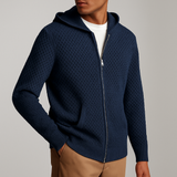 Men’s navy zip-up hoodie made from breathable perforated knit fabric with a hood and front pockets, lightweight and casual for everyday wear