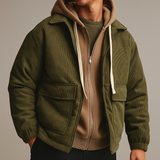 Men’s green corduroy shacket with utility pockets and hooded layering, designed for casual rugged style and comfort.