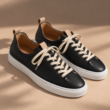 Pair of Black Montaro leather sneakers with cream contrast laces