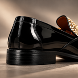 Close-up of the patent leather heel on Roma Lucido loafers, Gold glitter vamp visible