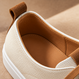 Close-up of heel pull tab on White Montaro leather sneaker