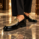 Roma Lucido patent loafers in Gold glitter worn on a marble floor