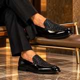 Roma Lucido patent loafers in Black glitter worn with tailored trousers