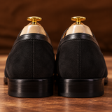 Close-up of Milano Black suede penny loafer heel