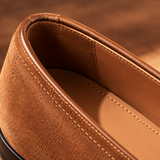 Close-up of Milano Tan suede penny loafer heel and lining