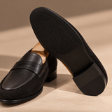 Sole view of Milano Black suede penny loafer