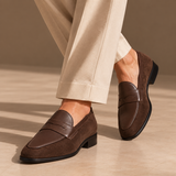 Milano suede penny loafers in Chocolate worn on feet